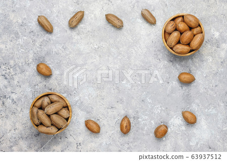 Pecan nuts on light background,top view 63937512