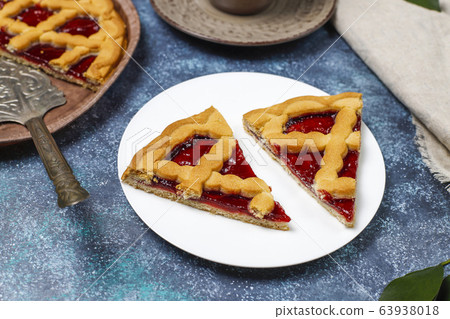 Delicious traditional berry cherry pie Crostata on grey dark background 63938018