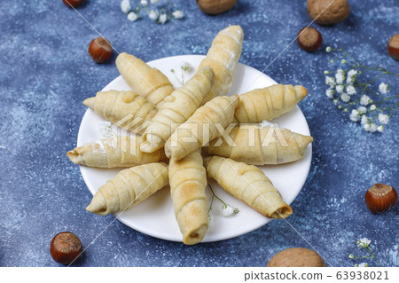 Traditional Azerbaijan holiday Novruz cookies mutaki on white plate on dark background 63938021