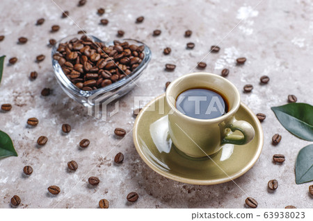 Composition with roasted coffee beans and coffe bean shaped cookies 63938023