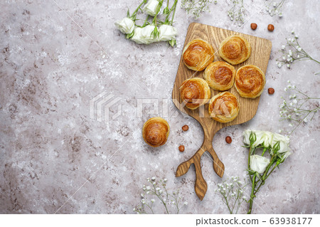 Azerbaijan national pastry qogal on white plate on light background ,top view,spring new year celebration Novruz holiday. 63938177