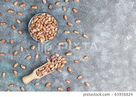 Legumes and beans assortment in different bowls on light stone background . Top view. Healthy vegan protein food. 63938824