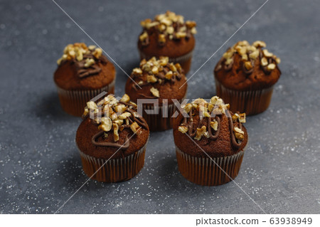 Chocolate-walnut muffins with coffee cup with walnuts on dark background ,Selective Focus. 63938949