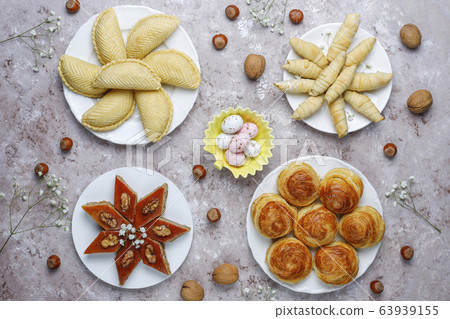 Traditional Azerbaijan sweets shakarbura,bakhlava,qogal,mutaki cookies on light background,Azerbaijan holiday Novruz background. 63939155