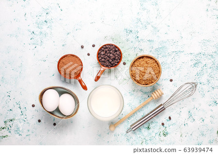 Cupcake baking background with kitchen utensils. 63939474