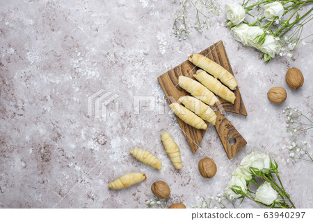 Traditional Azerbaijan holiday Novruz cookies mutaki on white plate on light background Traditional Azerbaijan holiday Novruz cookies mutaki on white plate on light background 63940297