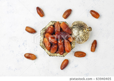 Beautiful bowl full of date fruits symbolizing Ramadan,top view 63940405
