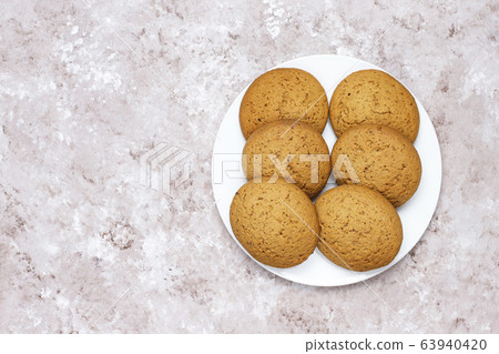 American style peanut butter cookies on light concrete background. American style peanut butter cookies on light concrete background. 63940420