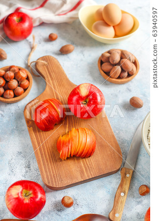 Baking concept of autumn apple pie. View from above on kitchen table. Cooking baking process with ingredients. 63940597