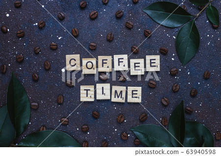 Composition with roasted coffee beans and coffe bean shaped cookies Composition with roasted coffee beans and coffe bean shaped cookies 63940598