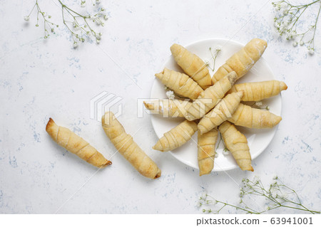 Traditional Azerbaijan holiday Novruz cookies mutaki on white plate on light background 63941001