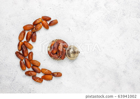Beautiful bowl full of date fruits symbolizing Ramadan,top view 63941002