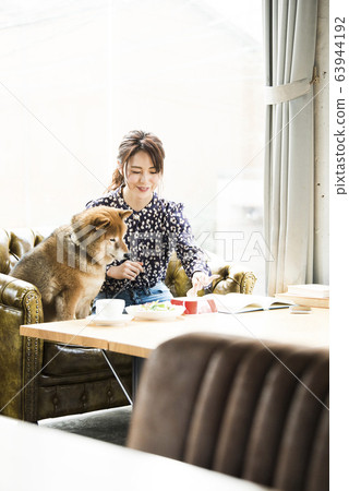 Dock cafe woman dog Dock cafe woman dog 63944192