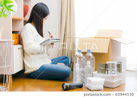 Woman managing stockpiling Disaster prevention Disaster Measures Checklist Copy space 63944530