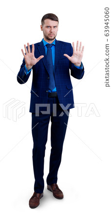 Businessman moving away with hands palms showing refusal gesture. 63945060