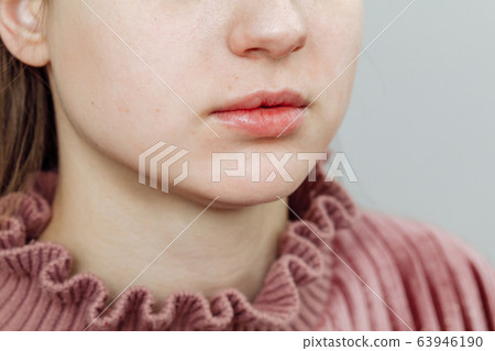 Lips after permanent makeup in beauty salon 63946190