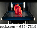 3d printer prints the model of heart, process of printing organs on a 3d printer, creating a model of the human heart. 63947319