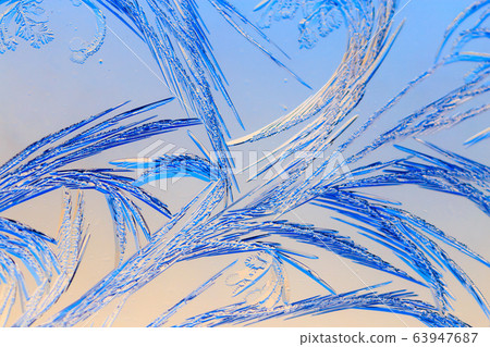 Natural pattern on glass at dawn of the sun. 63947687