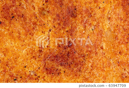Brown bread crust as an abstract background 63947709