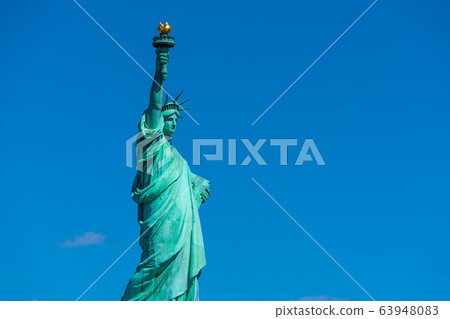 The Statue of Liberty under the blue sky background, Lower Manhattan, New York City, Architecture and building with tourist concept The Statue of Liberty under the blue sky background, Lower Manhattan, New York City, Architecture and building with tourist concept 63948083