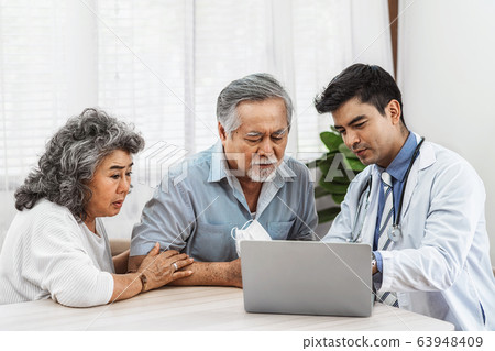 Doctor using technology laptop to explain and talking for auscultate Asian grandparent patient in house, healthcare with Long live and Elderly society, Prevent epidemic, Covid19 Disease concept Doctor using technology laptop to explain and talking for auscultate Asian grandparent patient in house, healthcare with Long live and Elderly society, Prevent epidemic, Covid19 Disease concept 63948409