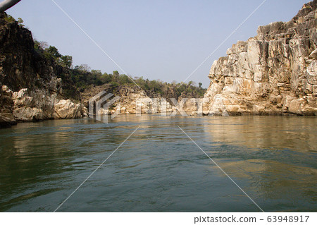 River Flanked by Rocks at Bedaghat 63948917
