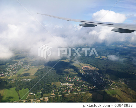 Airplane wing in flight Airplane wing in flight 63948932