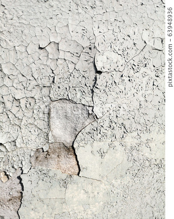 Stucco cracked on the wall as abstract background Stucco cracked on the wall as abstract background 63948936