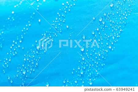Raindrops on a tent as an abstract background Raindrops on a tent as an abstract background 63949241