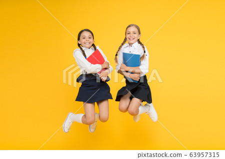 funny education. little girls in school uniform. funny education. little girls in school uniform. 63957315