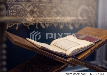 Quran islamic holy book on dark background with 63957461