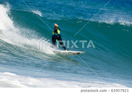 Surfer riding waves on the island of fuerteventura Surfer riding waves on the island of fuerteventura 63957921