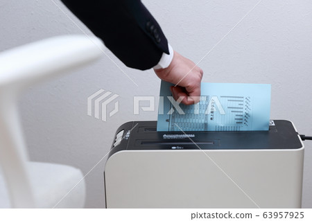 Shredder (office businessman work faceless copy space person electronics suit male) 63957925