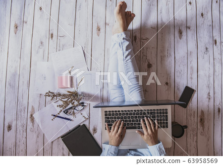friendly workspace - girl working from home 63958569