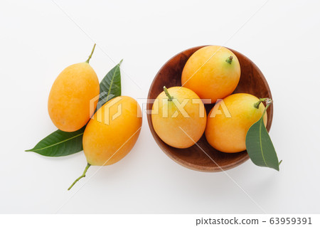 Marian plum in wooden bowl, top view 63959391