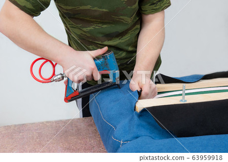 manufacture of upholstered furniture, furniture upholstery with a pneumatic stapler 63959918