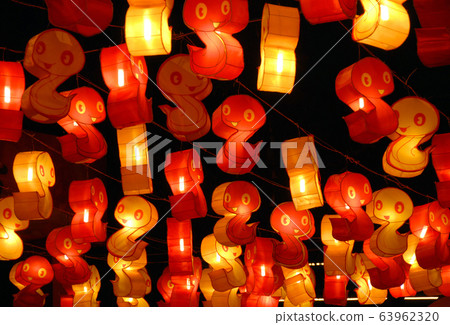 Chinese lanterns in Chengdu at the Wuhou Temple Lantern Festival in Chengdu, Sichuan, China.  The lanterns are for Chinese New Year for the Year of the Snake.  The Chinese lanterns are red and gold. 63962320