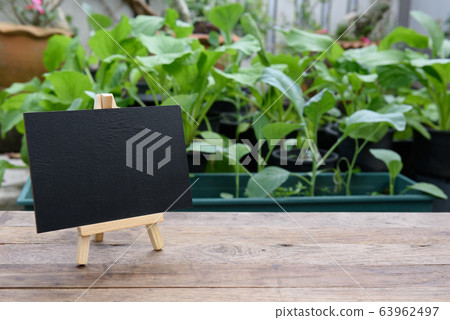 Blank black board on wooden plank for Blank black board on wooden plank for 63962497