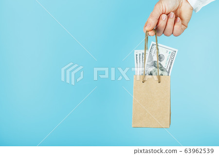 A small paper bag for financial aid and support A small paper bag for financial aid and support 63962539