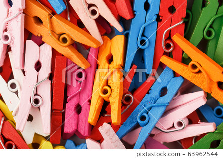 Colorful Wooden clothespins close-up as texture Colorful Wooden clothespins close-up as texture 63962544