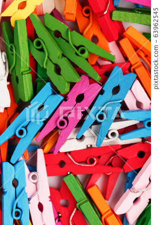 Colorful Wooden clothespins close-up as texture Colorful Wooden clothespins close-up as texture 63962545