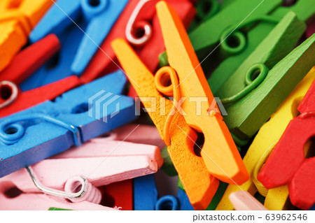 Colorful wooden clothespins close-up as a texture Colorful wooden clothespins close-up as a texture 63962546