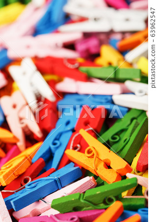 Colorful Wooden clothespins close-up as texture Colorful Wooden clothespins close-up as texture 63962547