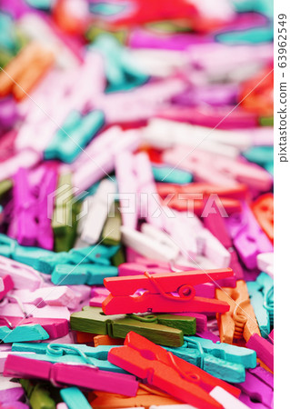 Colorful Wooden clothespins close-up as texture Colorful Wooden clothespins close-up as texture 63962549