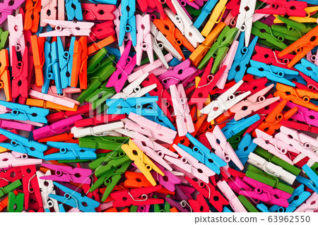 Small multi-colored clothespins as a full-screen 63962550