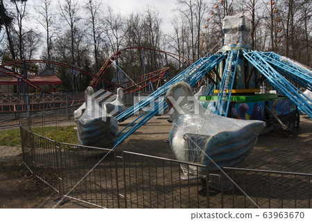 Carousels closed due coronavirus COVID-19 quarantine in the city park with nobody, all people at home 63963670