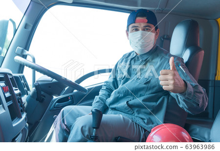 Truck driver wearing a mask Truck driver wearing a mask 63963986