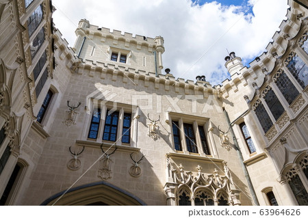 Exterior of the historic chateau Hluboka castle in Hluboka nad Vltavou, Czech Republic, sunny summer day Exterior of the historic chateau Hluboka castle in Hluboka nad Vltavou, Czech Republic, sunny summer day 63964626
