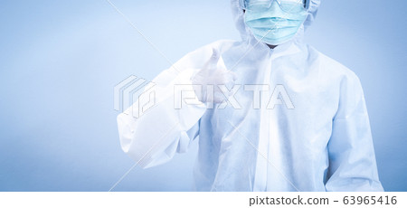 Woman nurse wearing mask raises the thumbs up to 63965416