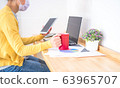 Asian women wearing masks work at home, using 63965707
